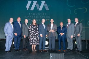 Gary Tasman Michael Christopher and Heather Adams accepts the 2021 Industry Appreciation Community Steward Award