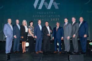 Mark Stevens Dan Adams and Terri Sobeck of Stevens Construction receive the 2021 Industry Appreciation Large Business of the Year Award